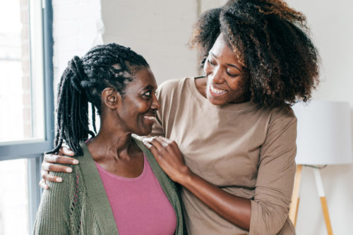 A staff counselor at Harford Belair shares encouraging words with a middled aged female client. '